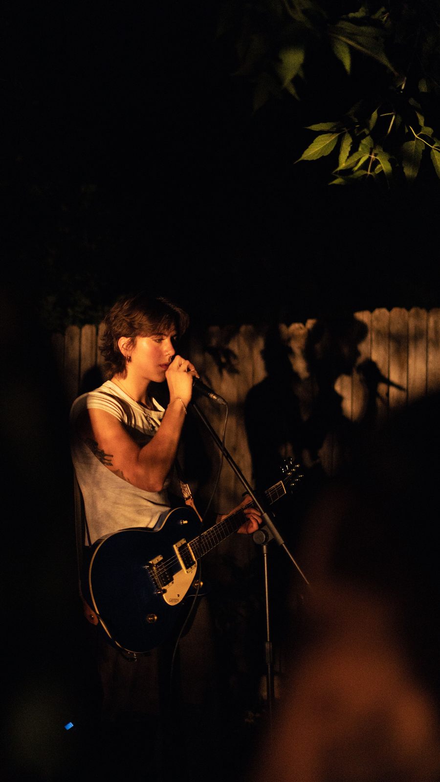 Gavriella playing guitar and singing