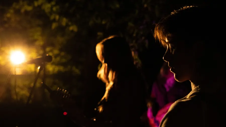 Two Lady Preacher singers lit in warm light